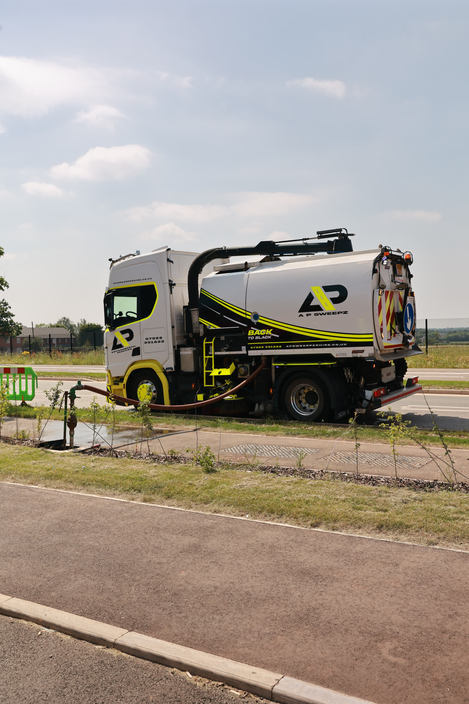 AP Sweepz road sweeper working on a road in the West Midlands